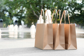 Delivered paper shopping bags in park
