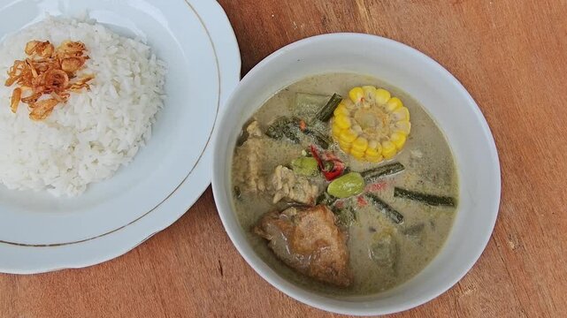 rice,Sayur lodeh is Indonesian vegetable soup from Javanese cuisine,prepared from vegetables cooked in coconut milk