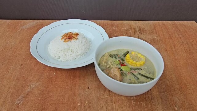 rice and curry,Sayur lodeh is Indonesian vegetable soup from Javanese cuisine,prepared from vegetables cooked in coconut milk