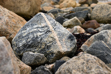 Nature’s art, beautiful and colorful rocks on the coast of Hudson Bay, Manitoba, Canada, as a nature background
