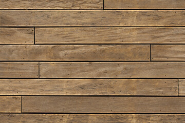 Obraz premium Close-up of grooved wooden decking boards forming a weathered brown wood texture background. Horizontal plank pattern for terrace, patio, and construction design uses