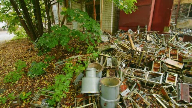A somber view of the scattered and decaying electronic devices, circuit boards, and metallic remnants of the Duga radar system, abandoned in the Chernobyl Exclusion Zone following the 1986 nuclear dis