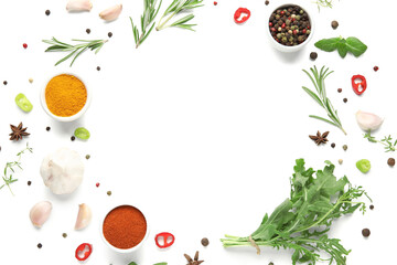 Frame made of fresh herbs and aromatic spices on white background