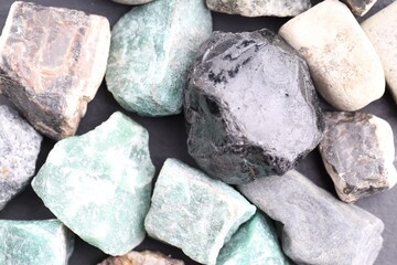 Different healing stones on table, top view