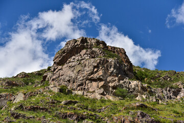 Rugged Rocky Outcrop Under a Bright Blue Sky