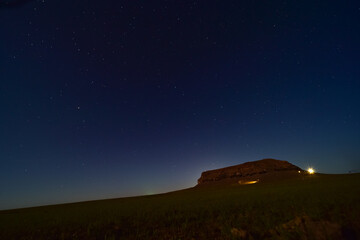 Starry Night Over a Hilltop Structure