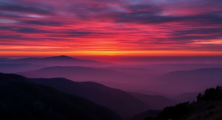Fototapeta premium Stunning Sunset Over Layered Mountains and Hazy Valley