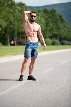 Model Flexing Muscles Outdoors