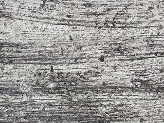 Rough gray texture of cement plaster, cracked floor, rough surface, uneven cement walls