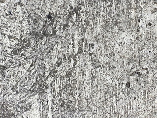 Rough gray texture of cement plaster, cracked floor, rough surface, uneven cement walls