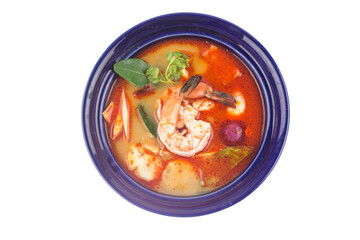 Tom Yam soup with shrimps, Thailand sour and spicy shrimp soup in blue plate on white background
