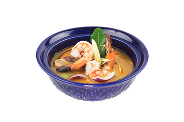 Tom Yam soup with shrimps, Thailand sour and spicy shrimp soup in blue plate on white background