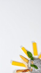 Chia Seed Pudding Delight with Mango, Mint, and Almonds on a Clean White Surface Backdrop