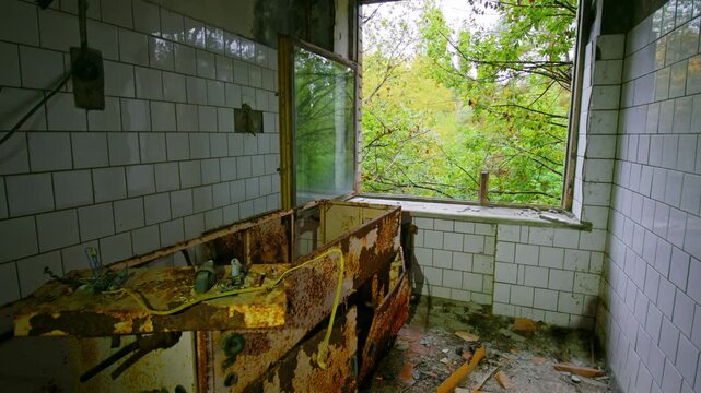 Footage captures the eerie, decaying interior of the abandoned Sanitary and Epidemiological Station in Pripyat, Ukraine, located within the Chernobyl Exclusion Zone. The scene features rusted equipmen