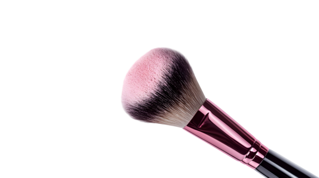 Closeup of a professional makeup brush with pink powder isolated on transparent background for applying blush and contouring