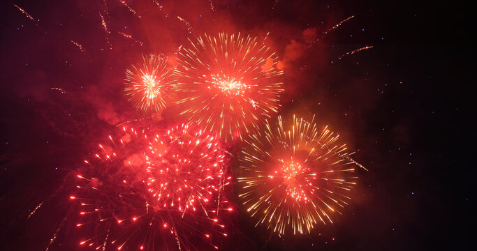 Red Firework celebrate anniversary in night time celebrate national holiday. Happy new year 2025, 4th of july holiday festival. Red firework Countdown to new year 2025 festival party time event