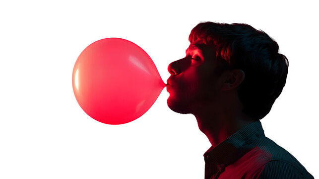 Young man blowing up a red balloon isolated on transparent background, creating a playful and vibrant atmosphere