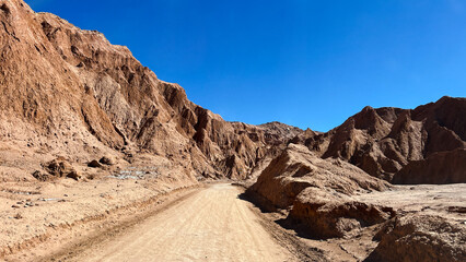 Dirt road going through Death Valley, close to San Pedro de Atacama in Chile. Natural rock...