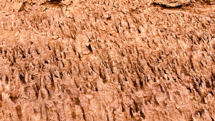 Detail of sandstone and stone layer structures creates the unique formation shape and texture. Natural rock formation in Atacama Desert close to San Pedro de Atacama in Chile. Background 