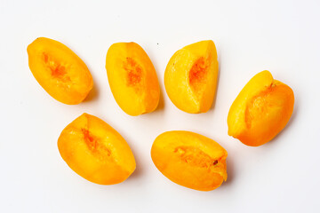 Fresh ripe apricots on a white background.