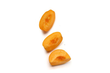 Fresh ripe apricots on a white background.