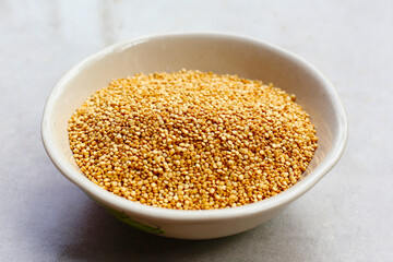 Raw quinoa seeds in a bowl.