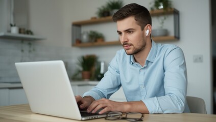 Young man working remotely on a laptop computer