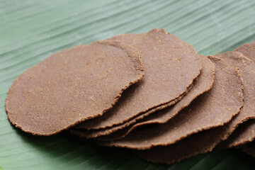 Fermented soybean discs, known as “Thua Nao,” a traditional Thai seasoning used to enhance flavor in Northern cuisine.