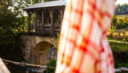 Wooden bridge over a stream, autumnal scenery