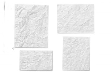 Crumpled white paper sheets in multiple sizes lying flat against transparent surface, showcasing clean minimalist texture