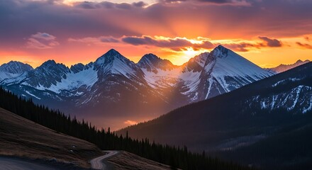 Majestic mountain range at sunset with vibrant colors and snow.