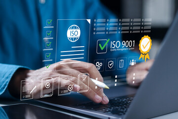 ISO 9001 Standard certification standardisation quality control concept, ISO 9001 for certified and quality management of organizations. Businessman using laptop with virtual icon.