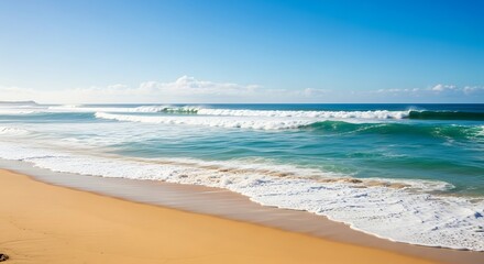 Obraz premium Beautiful beach with turquoise water and golden sand under a clear blue sky.