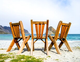 Wooden chairs on a beach, overlooking the sea