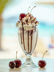 Decadent chocolate-drizzled milkshake topped with whipped cream and cherries.