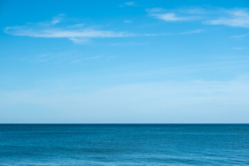 Nature of the ocean and blue sky Summer with sunshine, sandy beaches, clear blue waters sparkling against the blue sky. on an island with good ecology and environment Background for summer vacation
