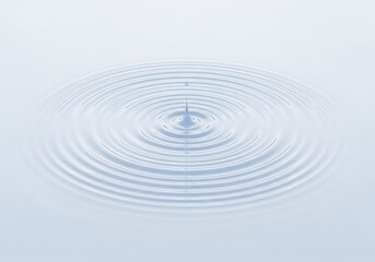 Captivating water drop creates hypnotic ripple pattern on calming surface