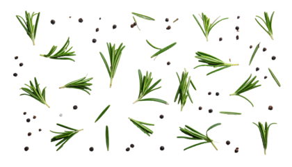 Fresh sprigs of green herbs scattered amongst peppercorns on a black background