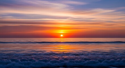 Obraz premium Vibrant Sunrise Over Ocean Waves.
