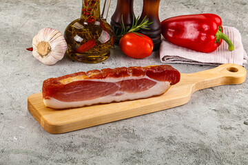 Piece prosciutto crudo over board