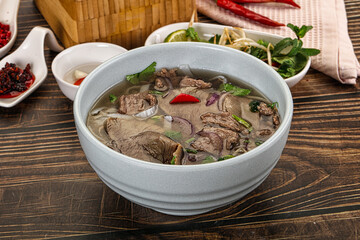 Vietnamese Pho Bo soup with beef and noodles