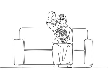 Single continuous line drawing an arab man sitting on the sofa holding a bouquet of flowers. A surprise from his beloved wife. Complete each other. Love. Surprise. One line design vector illustration