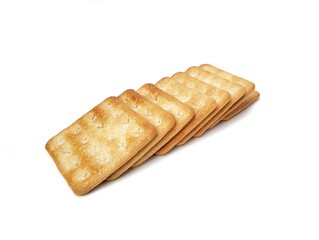 Pile of square sweet cracker biscuits isolated on white background 