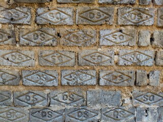 Close up textured brick wall, industrial background of traditional construction material for architecture, urban design, and rustic pattern concept.
