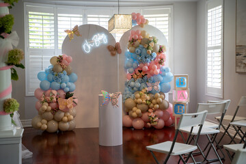 Baby shower decorations and event setup with balloon arrangements.