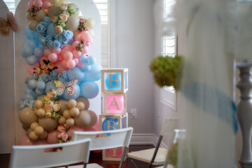 Baby shower decorations and event setup with balloon arrangements.