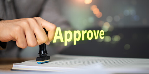 Business hand stamping approval on official document, symbolizing authorization, legal validation, contract agreement, compliance, certification, decision-making, quality assurance, trust, success.