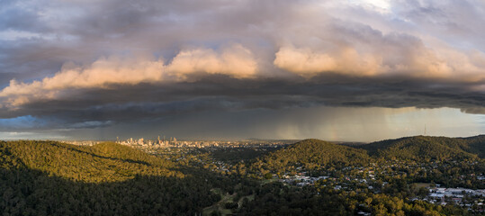 aerial view of storm clouds and rain over Brisbane city skyline 