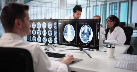 Doctors Carefully Studying MRI Scans