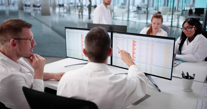 Hospital Doctors Review Medical Billing Codes Online For Diverse Team